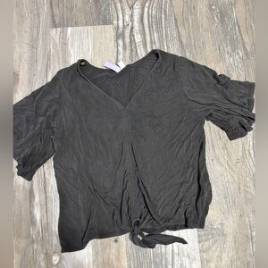 Size medium top needs an iron that’s all there’s a tie knot at the bottom